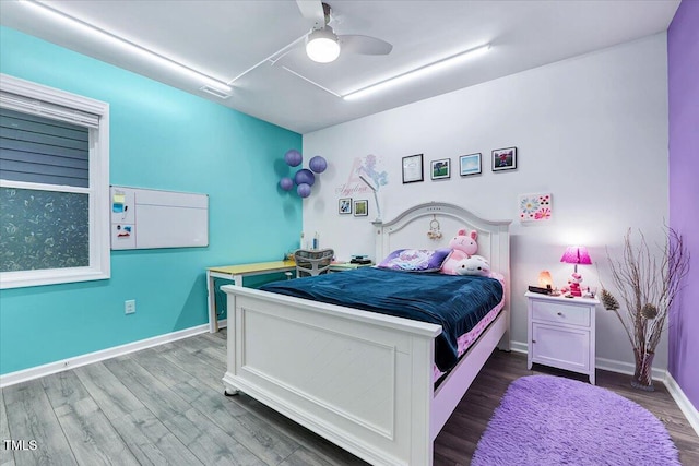 bedroom featuring ceiling fan and hardwood / wood-style floors