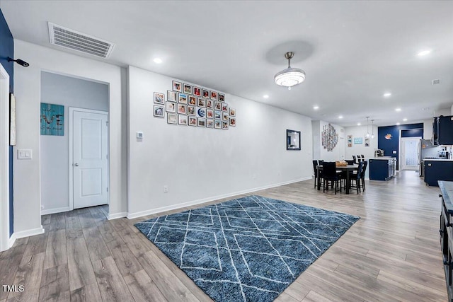 dining space with hardwood / wood-style flooring