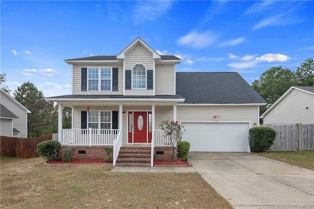 front of property with covered porch, a front yard, and a garage