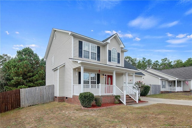 view of front of house with a front lawn and covered porch