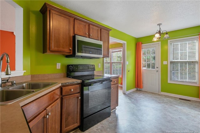 kitchen with sink, an inviting chandelier, black electric range, pendant lighting, and a textured ceiling