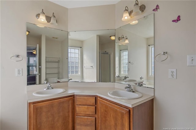 bathroom with vanity, an enclosed shower, and toilet