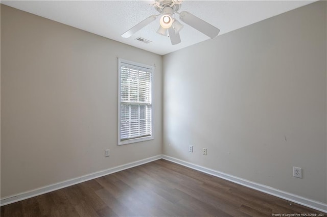 unfurnished room featuring ceiling fan and dark wood-type flooring