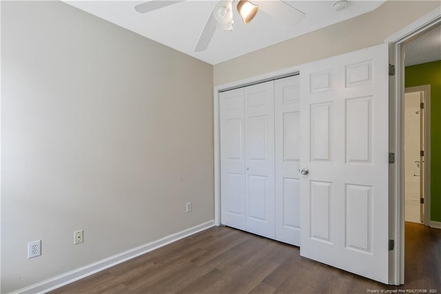 unfurnished bedroom featuring a closet, ceiling fan, and dark hardwood / wood-style floors