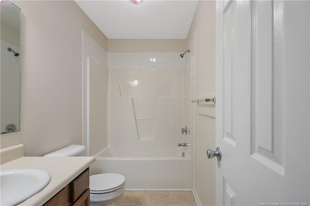 full bathroom with tile patterned floors, vanity, toilet, and tiled shower / bath combo