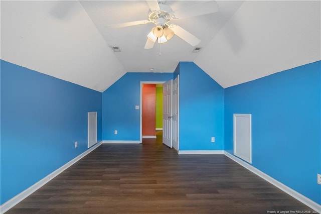 bonus room with vaulted ceiling, ceiling fan, and dark hardwood / wood-style flooring