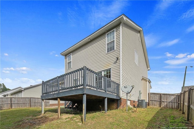 back of house with a yard and a wooden deck