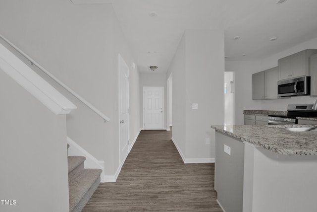 hallway with wood-type flooring