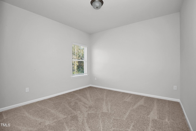 unfurnished room featuring carpet flooring