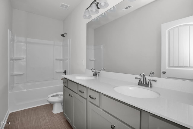 full bathroom featuring vanity, toilet, and shower / bath combination