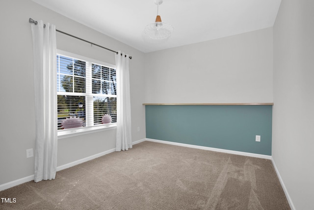 empty room featuring carpet flooring