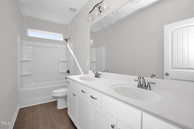 full bathroom featuring vanity, toilet, and bathtub / shower combination