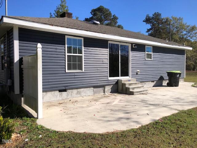 back of house with a patio