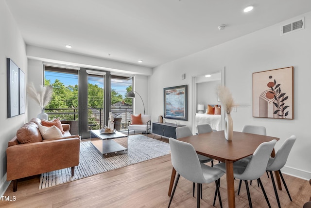 dining area with light hardwood / wood-style flooring