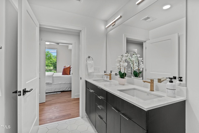 bathroom with vanity and hardwood / wood-style flooring