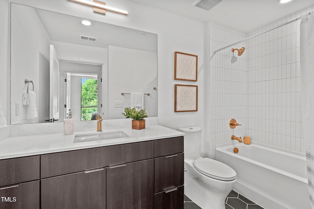 full bathroom featuring tile patterned flooring, shower / tub combo, vanity, and toilet