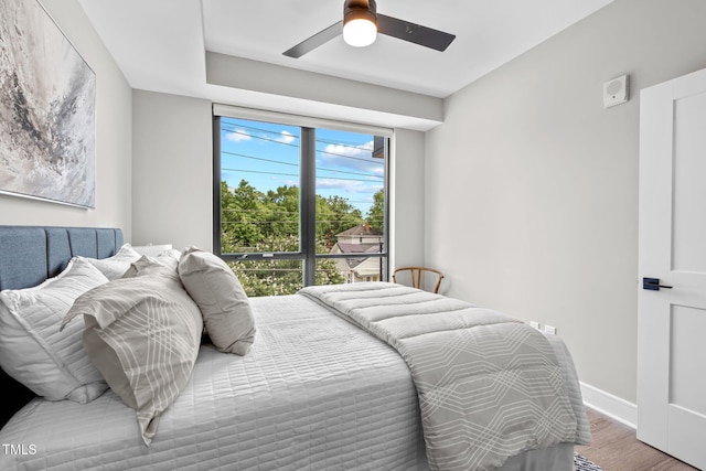 bedroom featuring ceiling fan and wood-type flooring