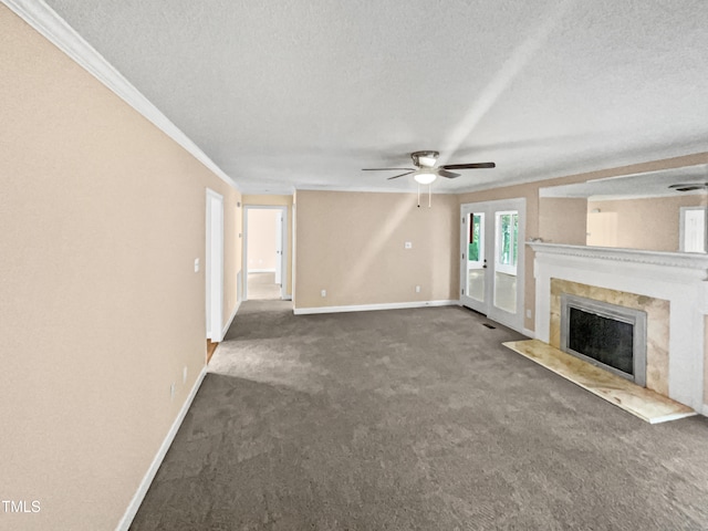 unfurnished living room featuring crown molding, ceiling fan, dark carpet, and a textured ceiling