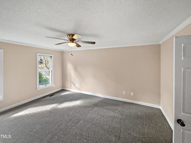 empty room featuring a textured ceiling, dark carpet, ceiling fan, and ornamental molding