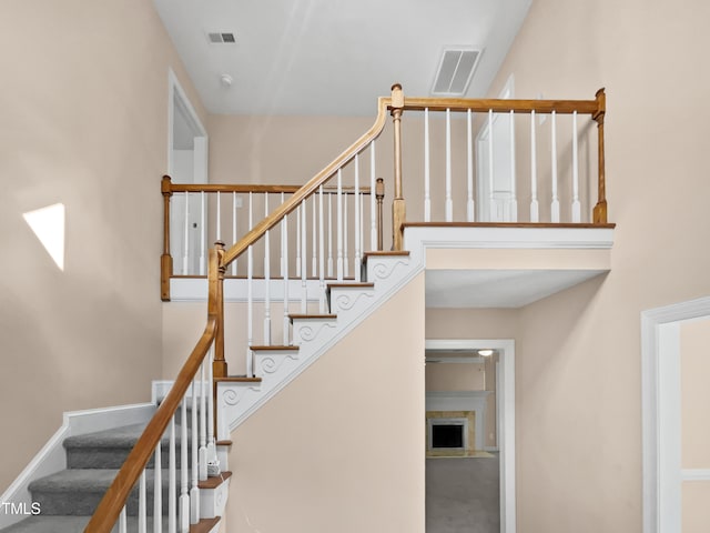 stairway with a fireplace