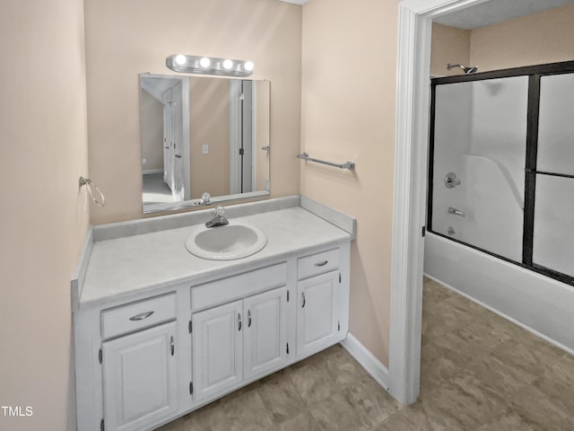 bathroom featuring vanity and enclosed tub / shower combo