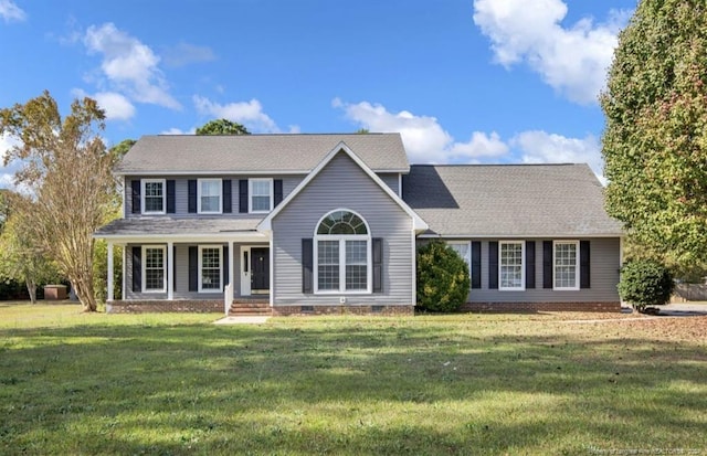 view of front facade featuring a porch and a front yard