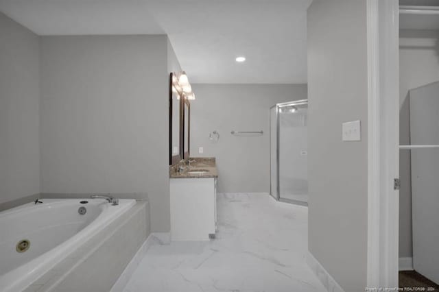 bathroom featuring shower with separate bathtub and vanity