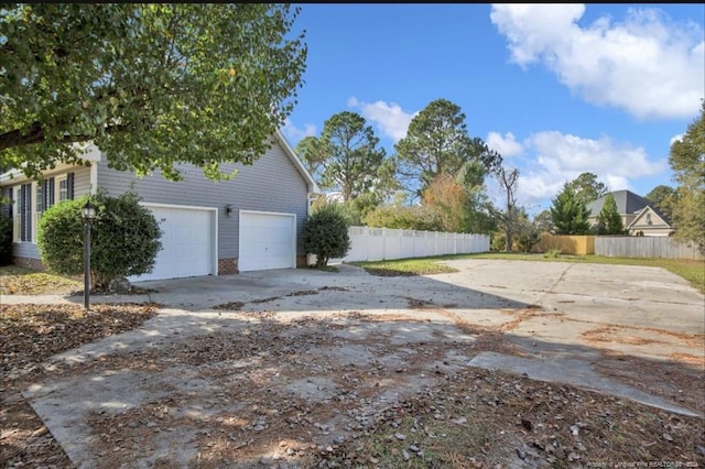 view of yard featuring a garage