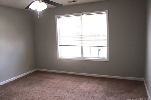 carpeted empty room with ceiling fan