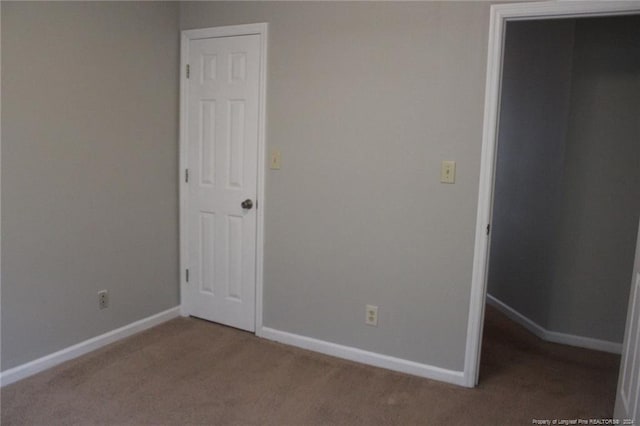 unfurnished bedroom featuring carpet flooring