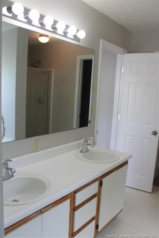 bathroom featuring vanity and walk in shower