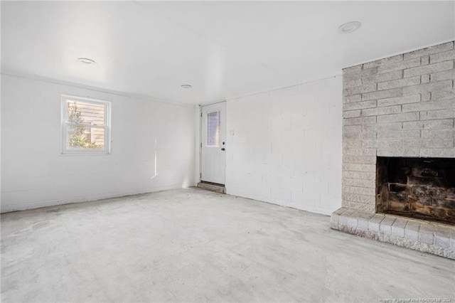 unfurnished living room featuring a fireplace