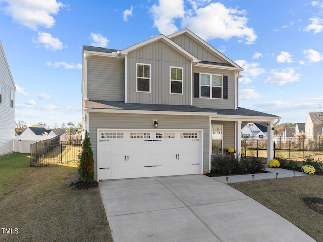 view of front of home with a front lawn and a garage