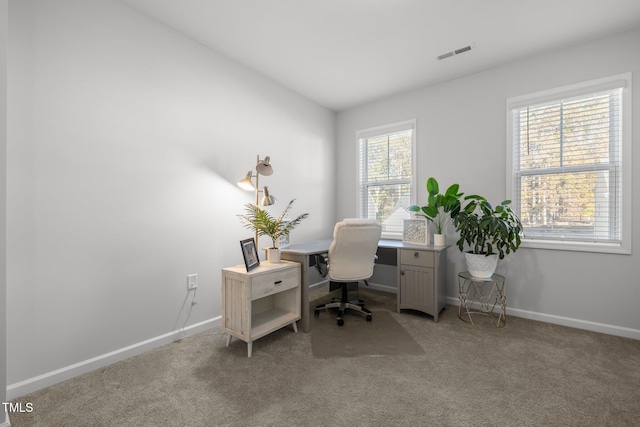 carpeted office featuring vaulted ceiling