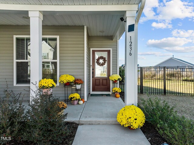 doorway to property with a porch