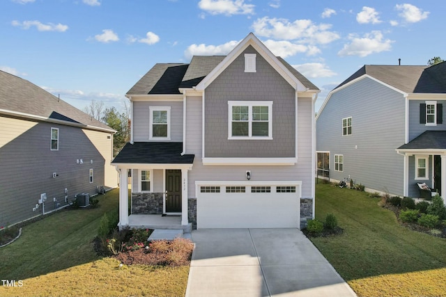 view of front of home featuring a front lawn, cooling unit, and a garage