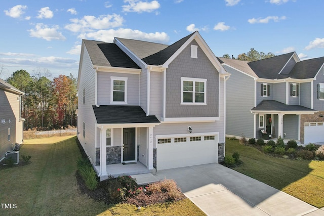 view of front of property with central AC unit, a garage, and a front lawn