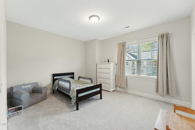 bedroom with light carpet