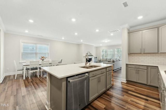 kitchen with backsplash, sink, stainless steel dishwasher, and dark hardwood / wood-style floors