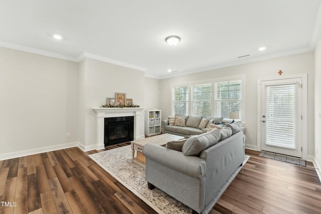 living room featuring dark wood-type flooring and ornamental molding