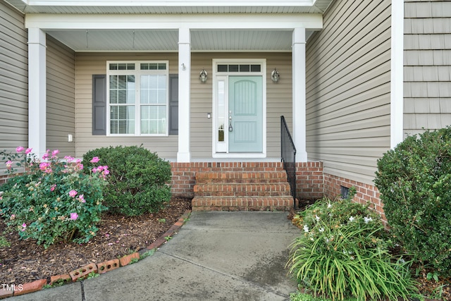 property entrance featuring covered porch