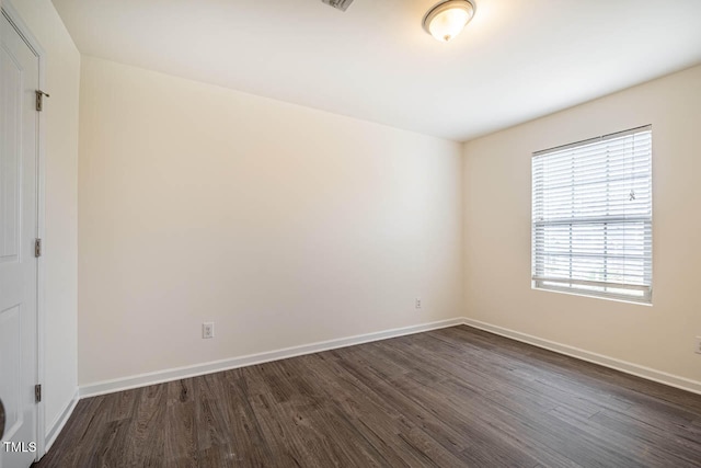 unfurnished room featuring dark hardwood / wood-style floors