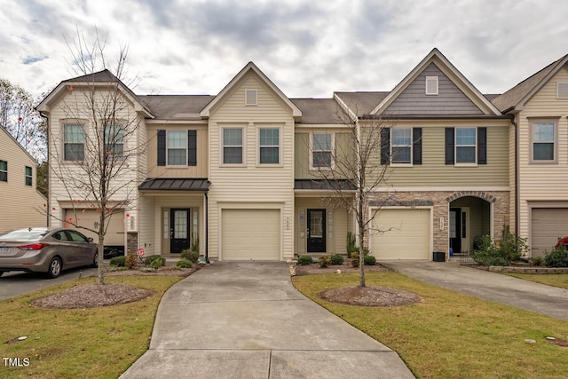 multi unit property featuring a front yard and a garage