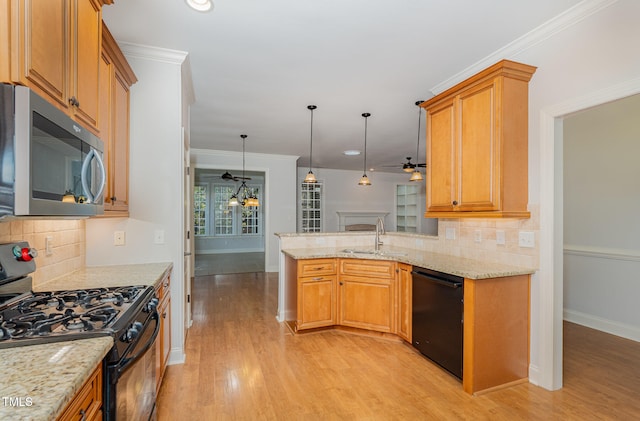 kitchen with black appliances, backsplash, kitchen peninsula, and sink