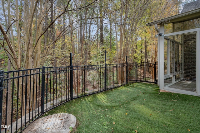 view of yard featuring a sunroom