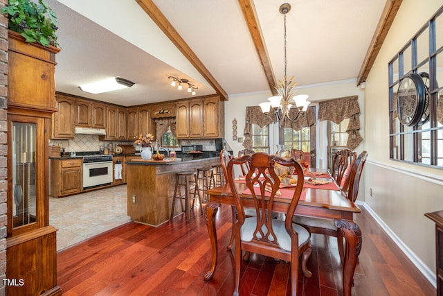 dining area featuring crown molding, lofted ceiling with beams, dark hardwood / wood-style flooring, and a chandelier