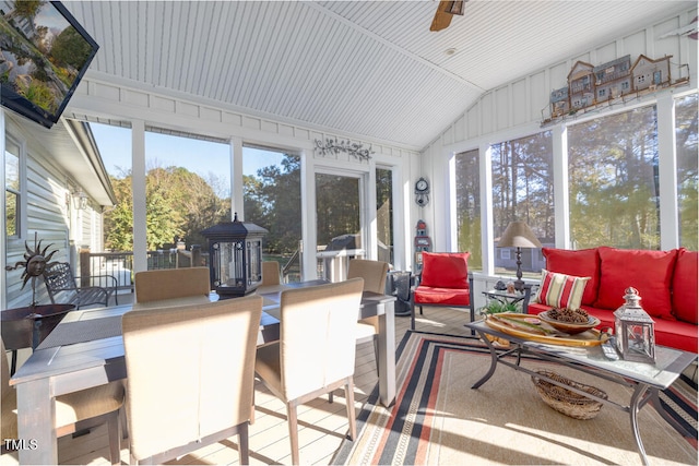 sunroom / solarium featuring ceiling fan and vaulted ceiling