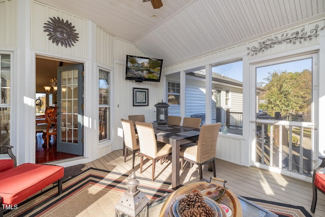 sunroom featuring lofted ceiling