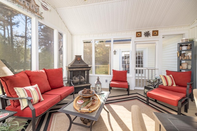 sunroom / solarium featuring lofted ceiling