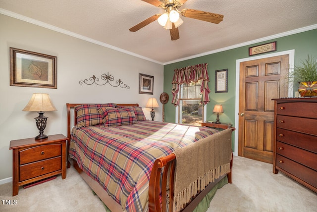 carpeted bedroom featuring a textured ceiling, ceiling fan, and crown molding